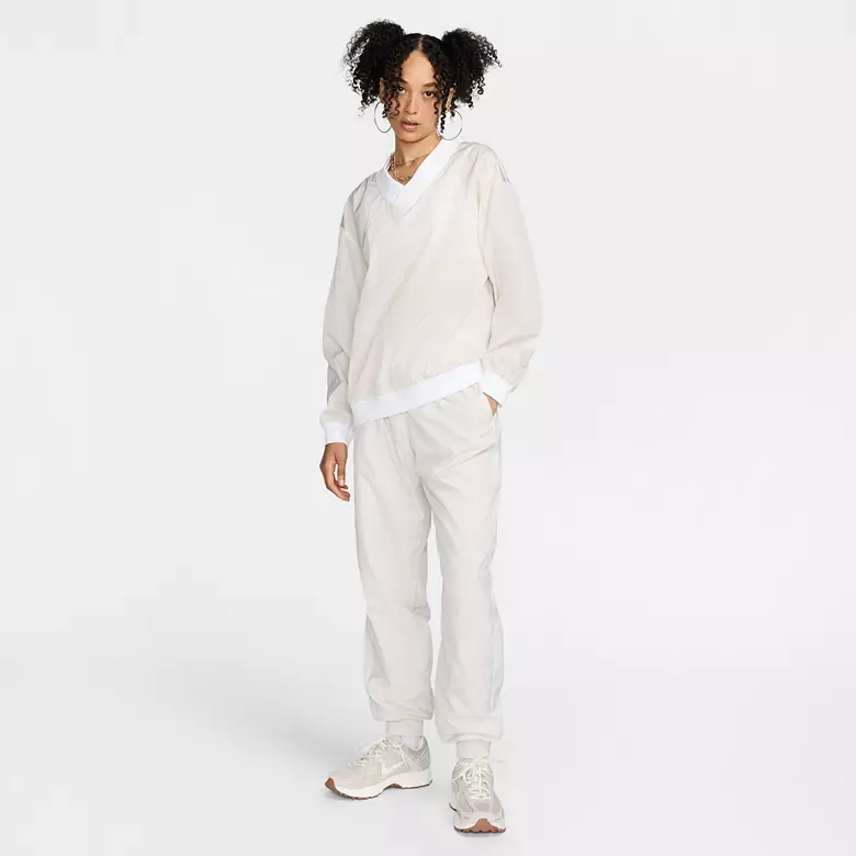 Nike Women's Sportswear Essential Loose UV Woven Long-Sleeve V-Neck Top